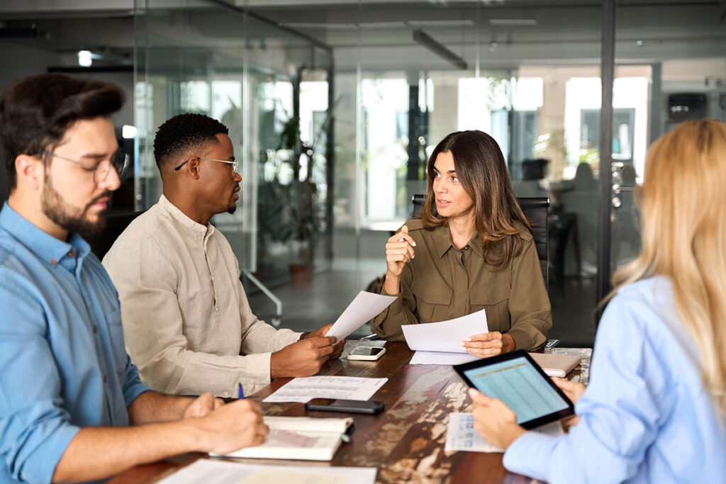 a group of business leaders discuss how to avoid accidental wage theft through compliant actions